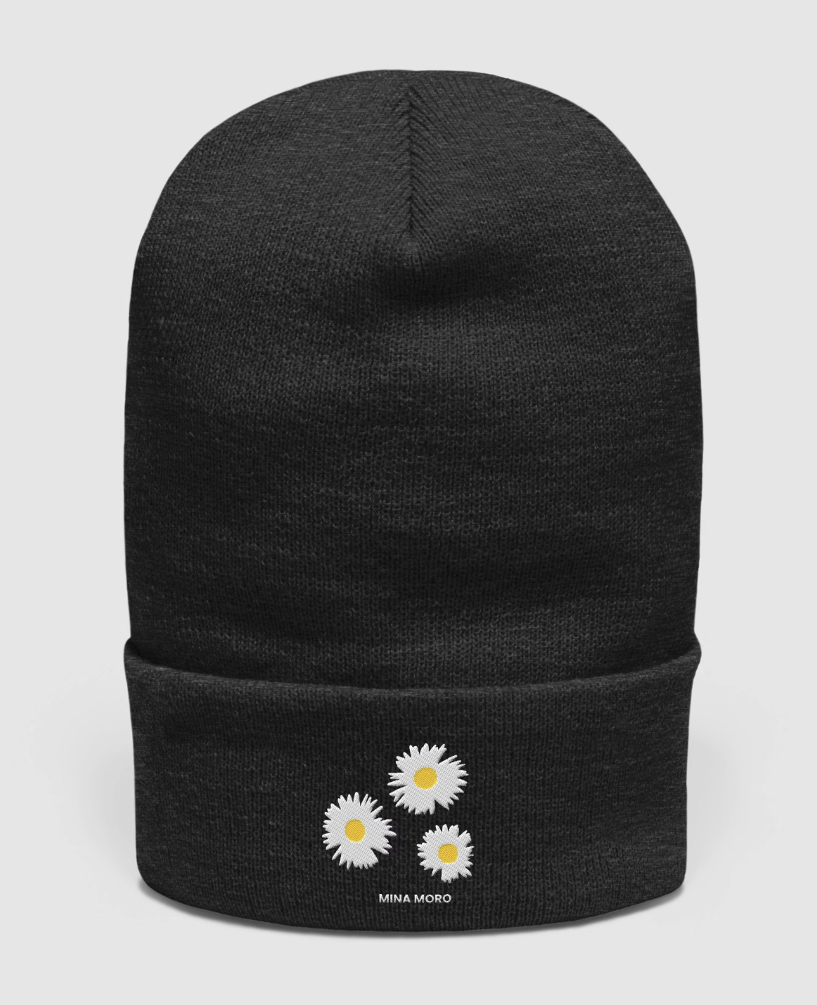 Charcoal beanie with three embroidered daisies on the cuff